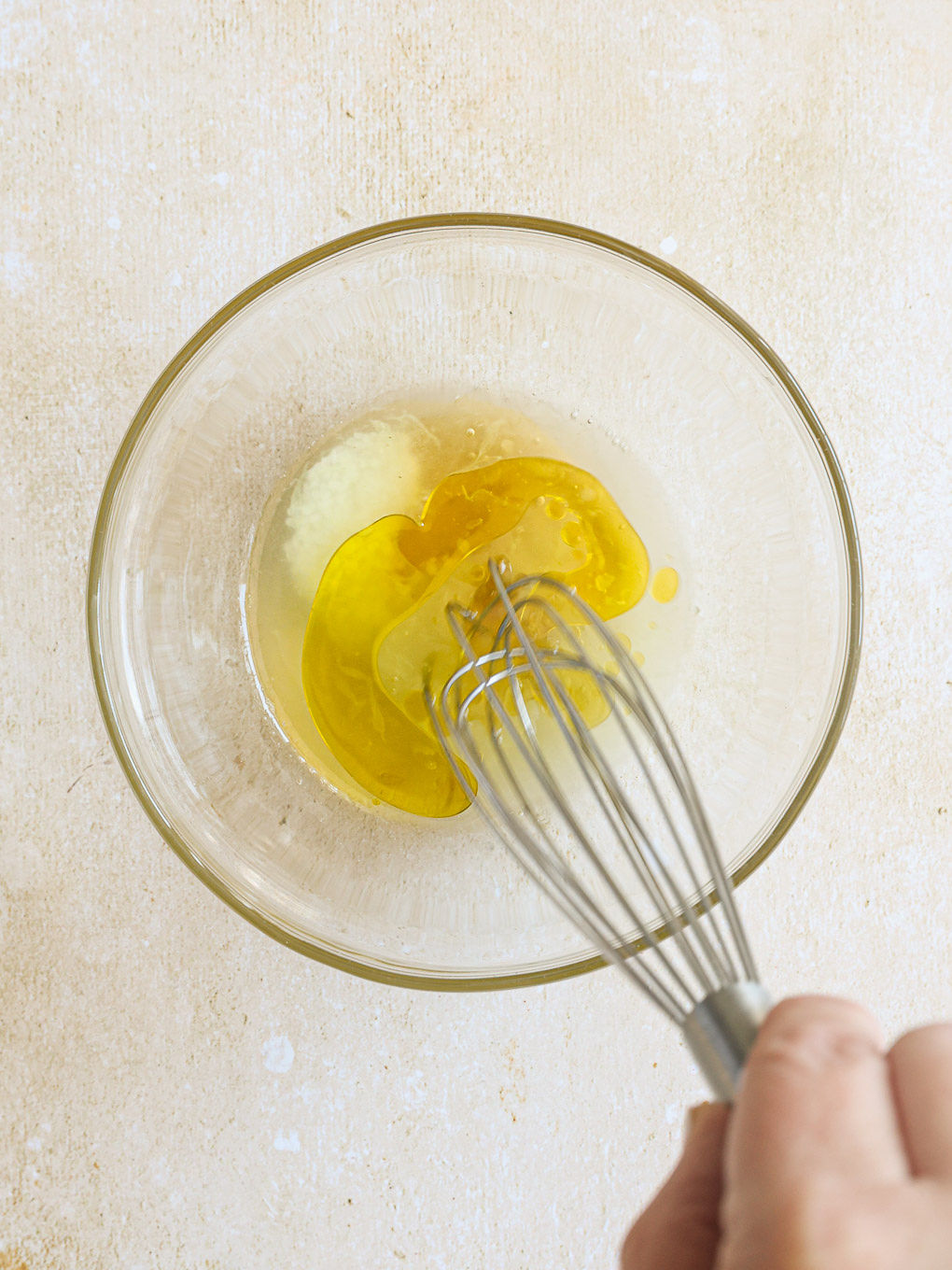 dressing for mango slaw in a glass bowl.