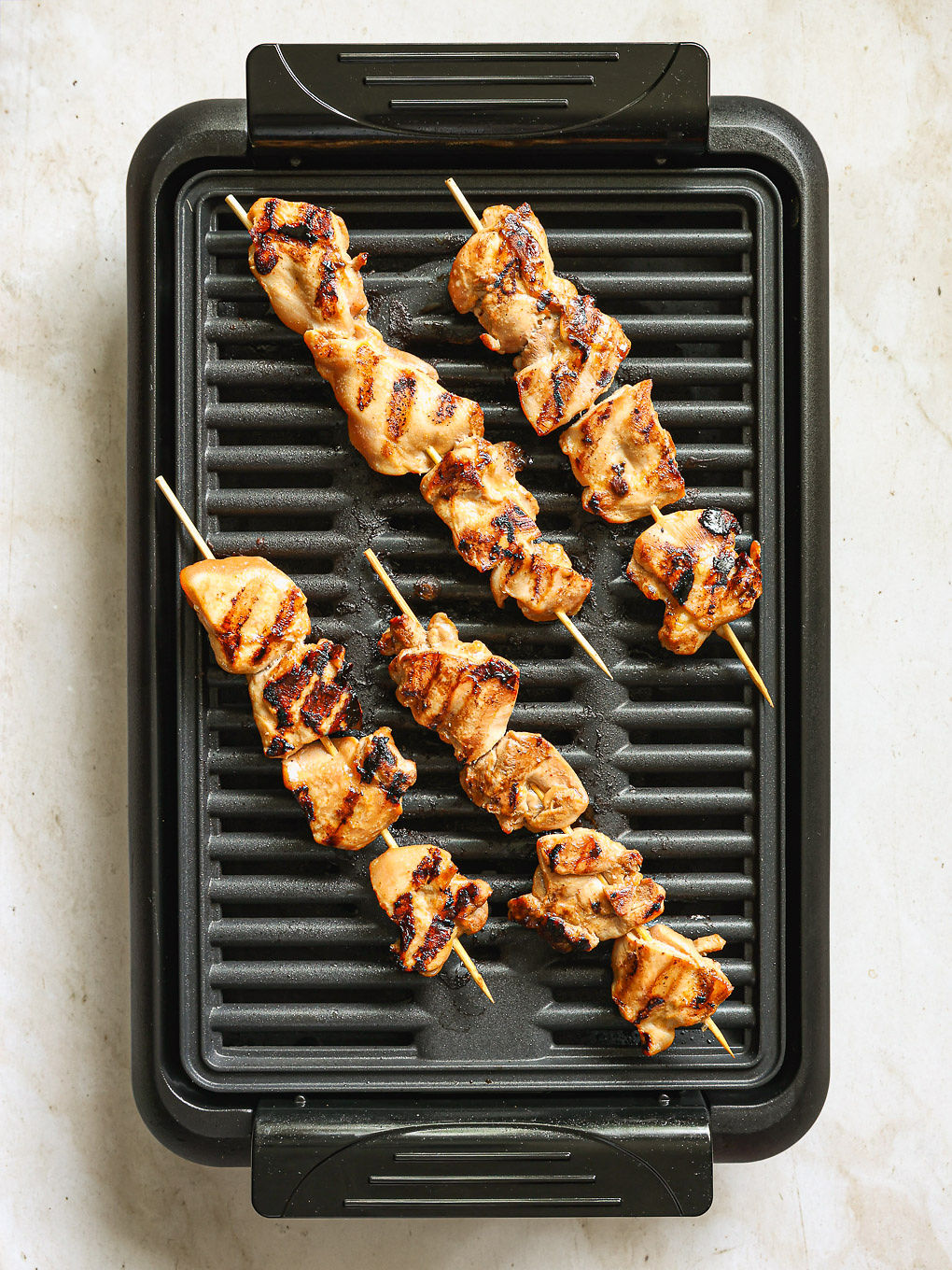 grilled skewers on a grill pan.