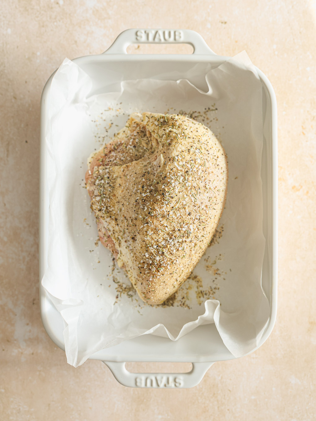 chicken breast covered in dry spices.