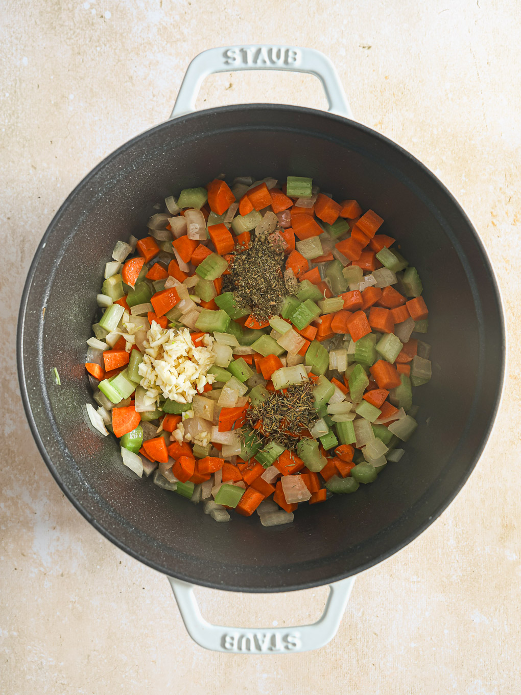 diced vegetables in a pot.