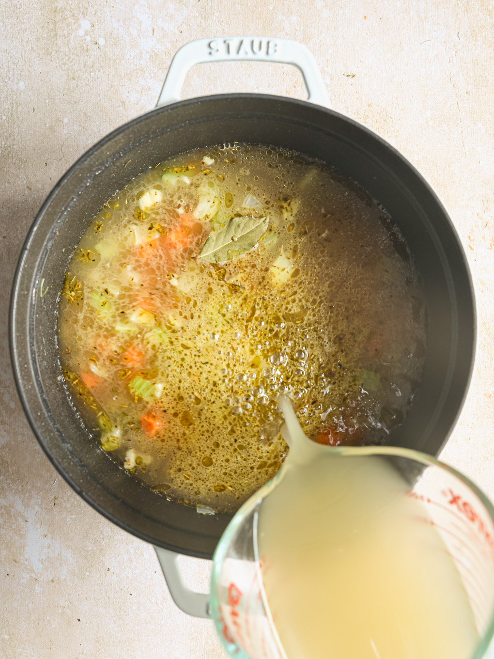 chicken stock in pot.
