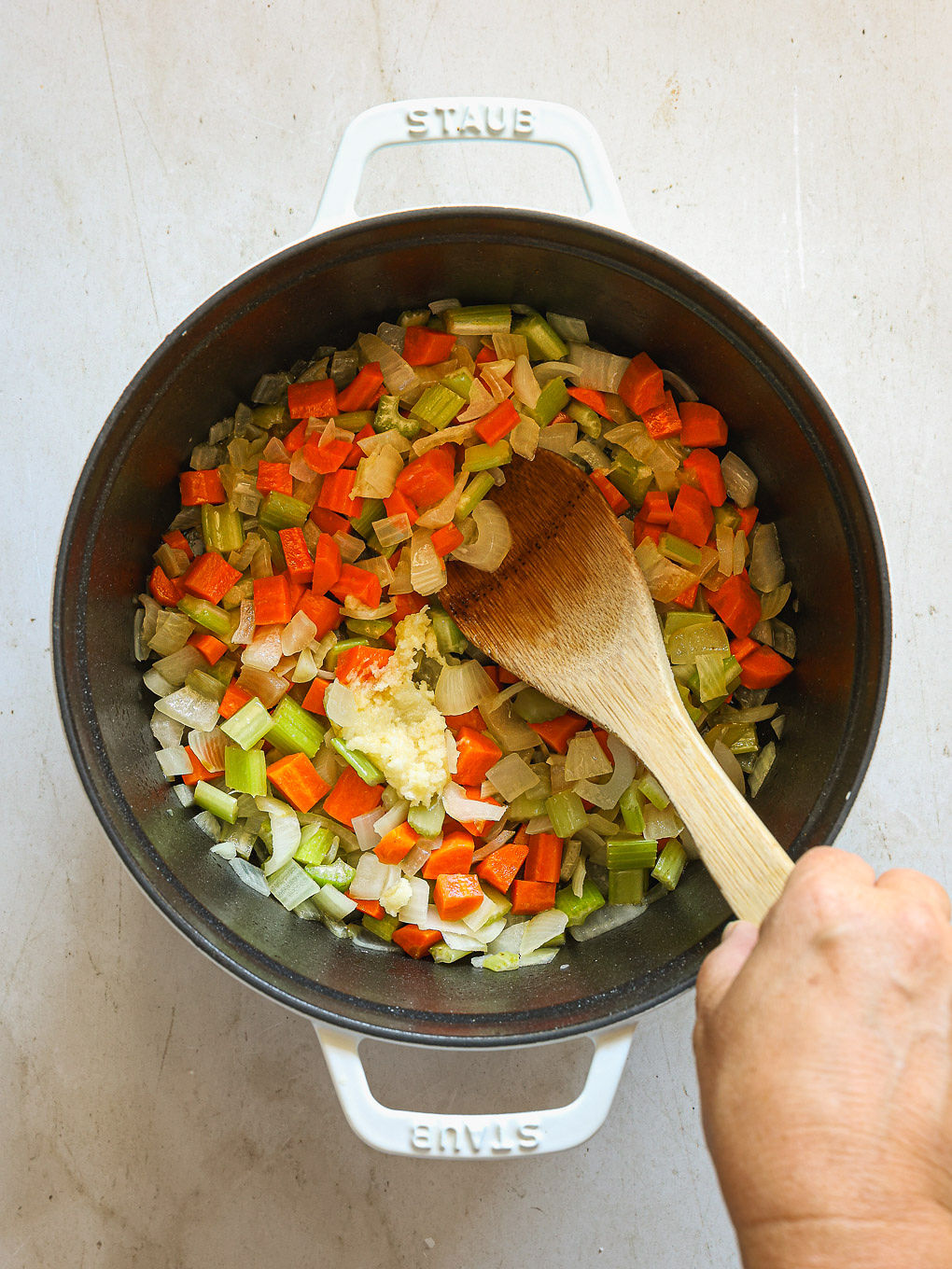 vegetables and spices in a pot.