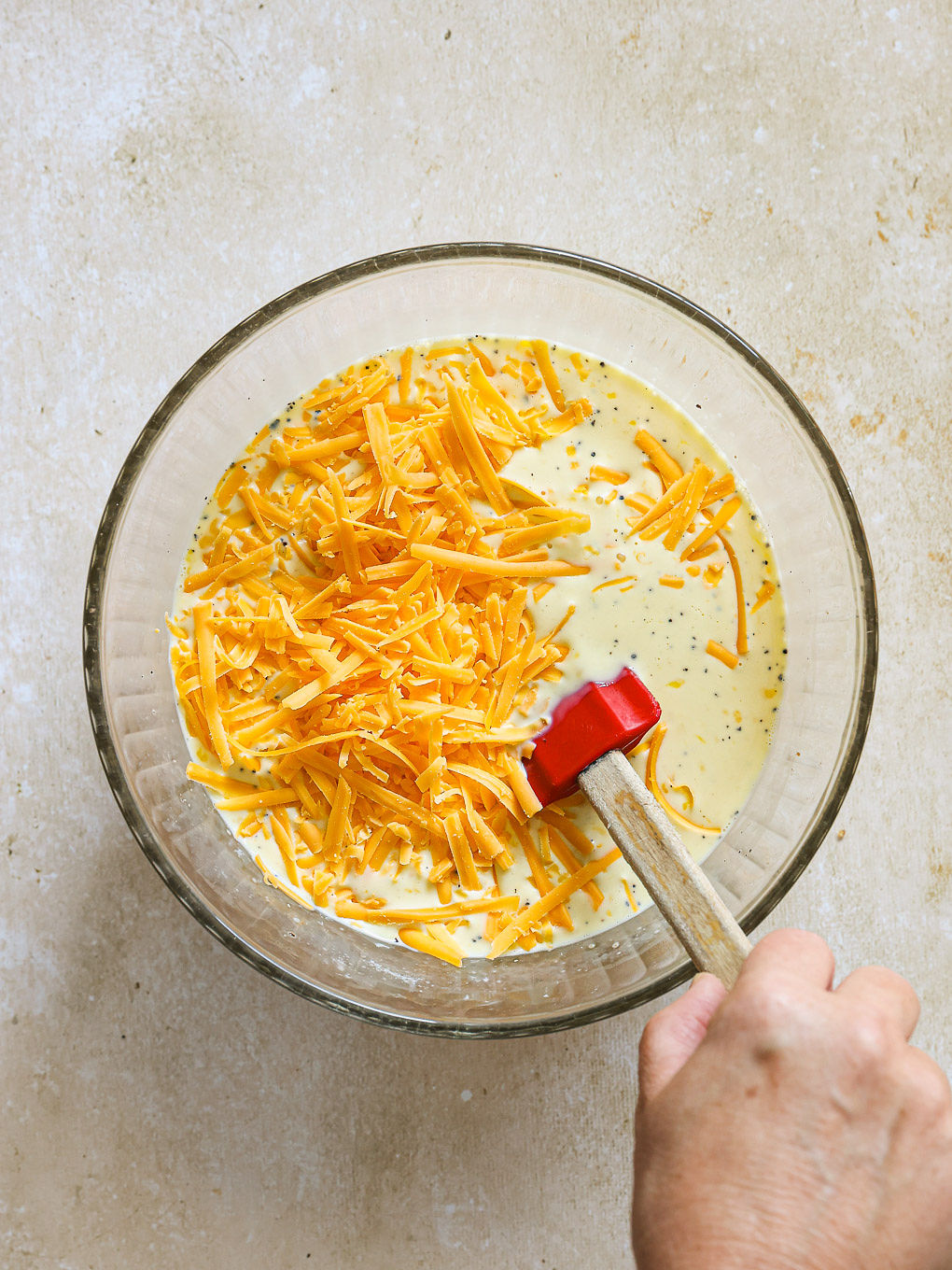shredded cheese with egg mixture.