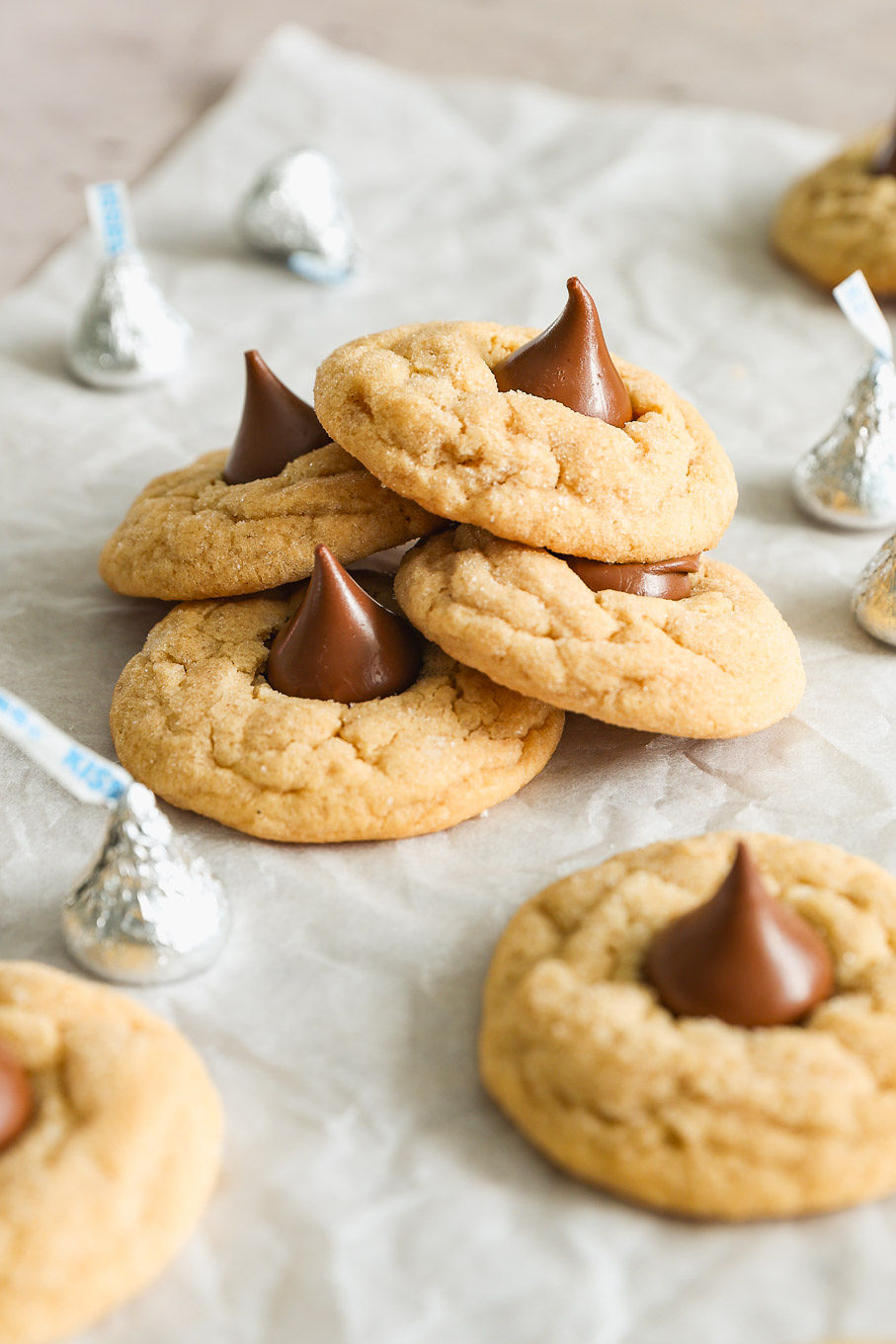 close up stacked peanut butter blossom cookies.