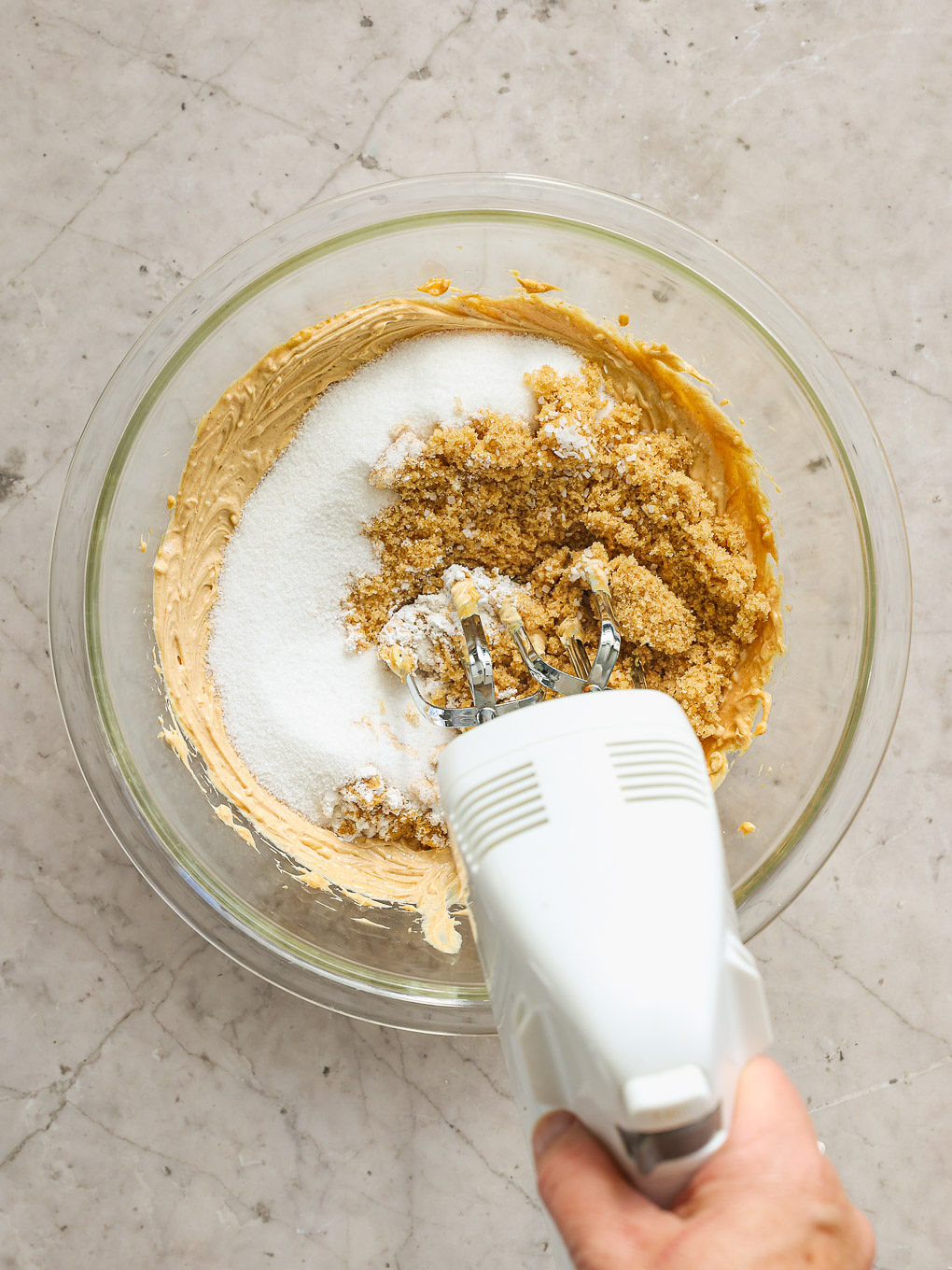 sugar and peanut butter in a glass bowl.