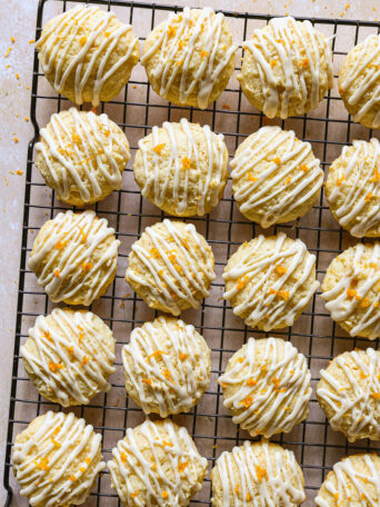 orange ricotta cookies on cooling rack.