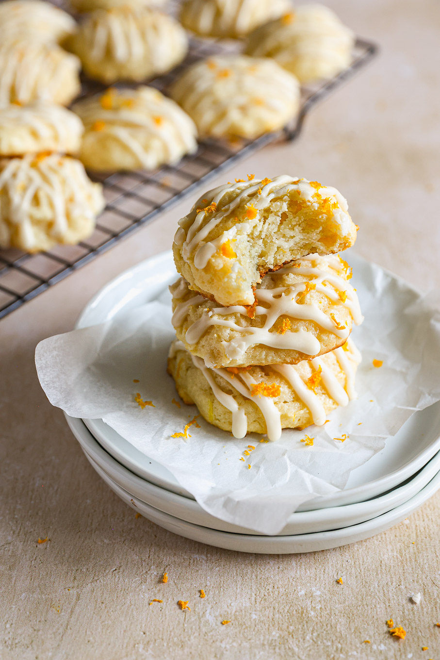 stacked cookies with ricotta cheese on a plate.