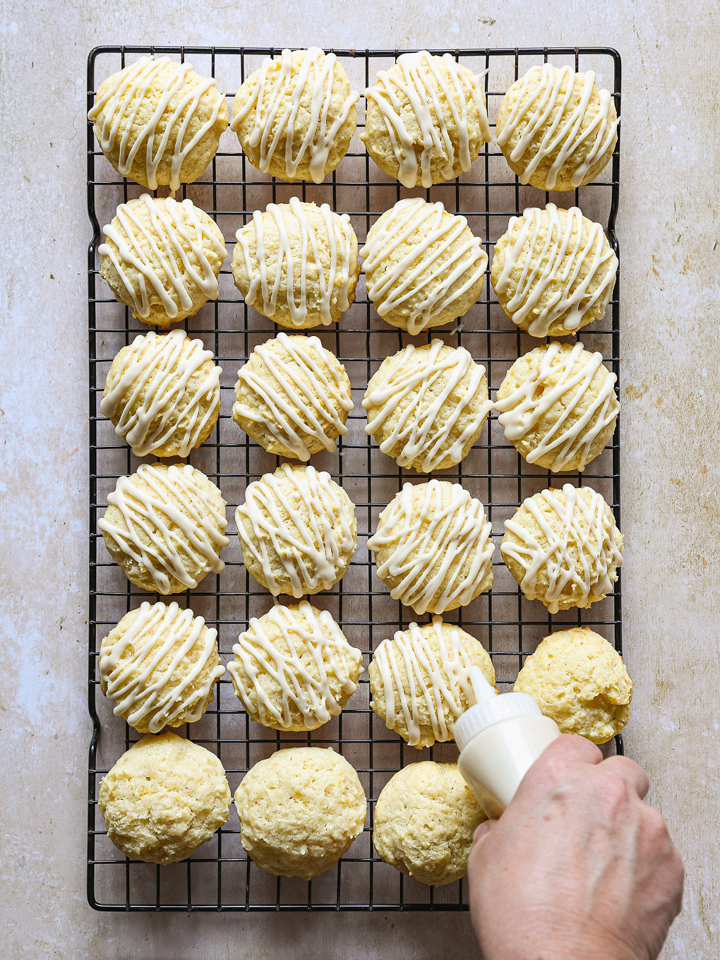 cookies being glazed.