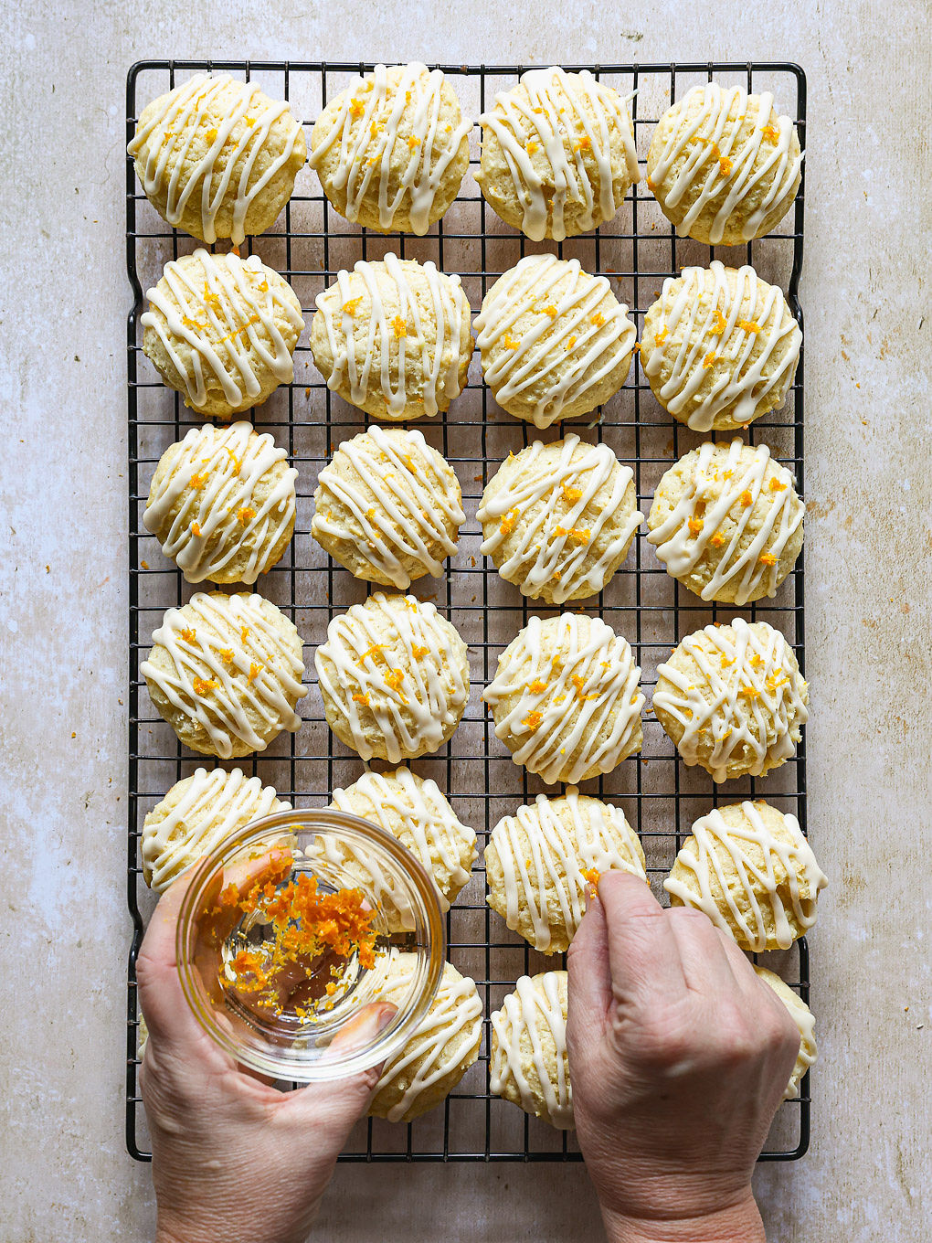 orange zest sprinkled over glazed cookies.
