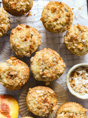 peach muffins on a cooling rack.