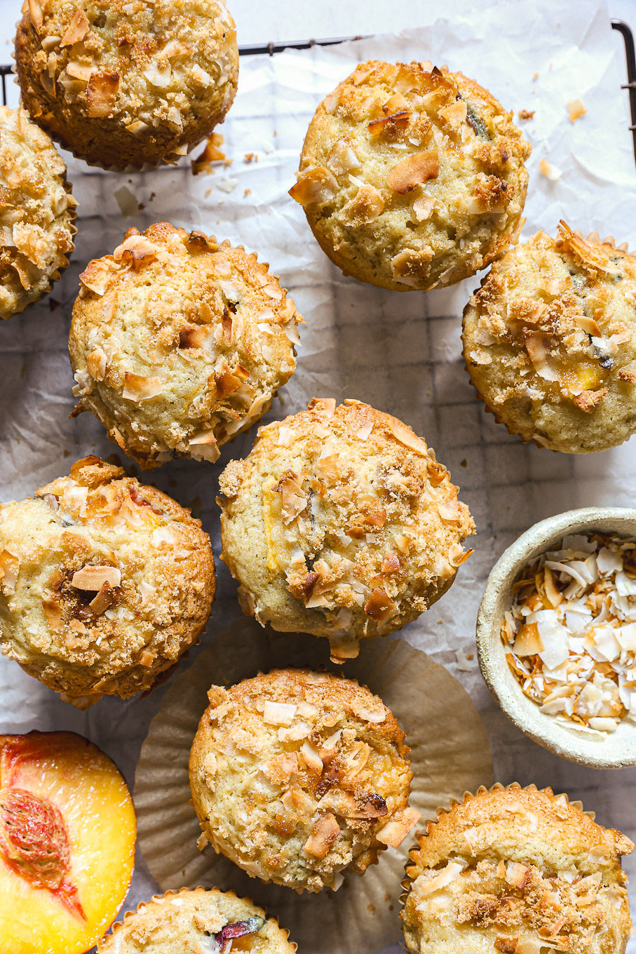 peach muffins on a cooling rack.