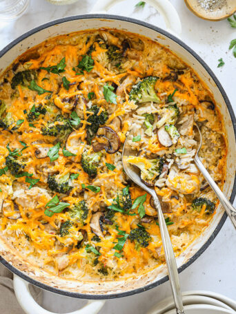 overhead close up rice broccoli chicken casserole in a skillet.