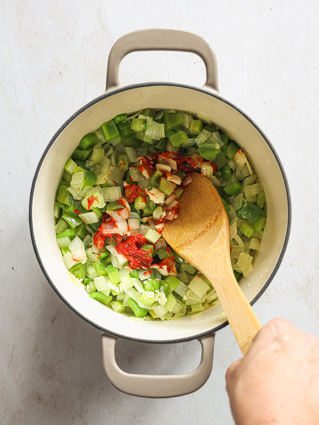 onions and peppers inside a pot.
