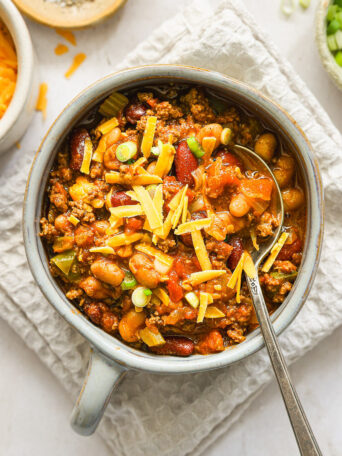 beef chili with cheddar cheese in a bowl.