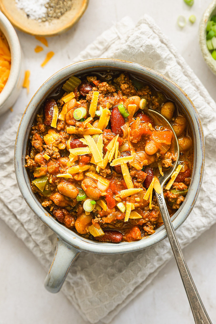 beef chili with cheddar cheese in a bowl.
